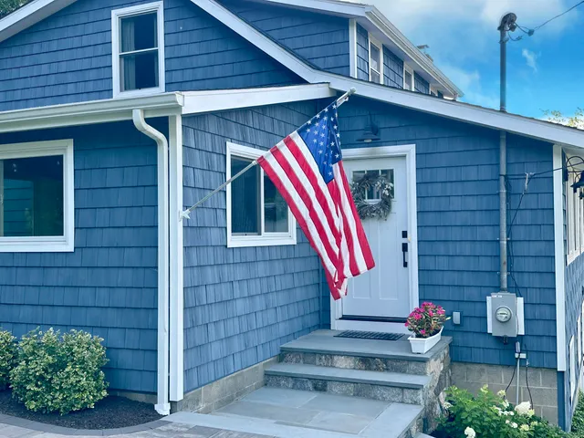 a front view of a house with fountain