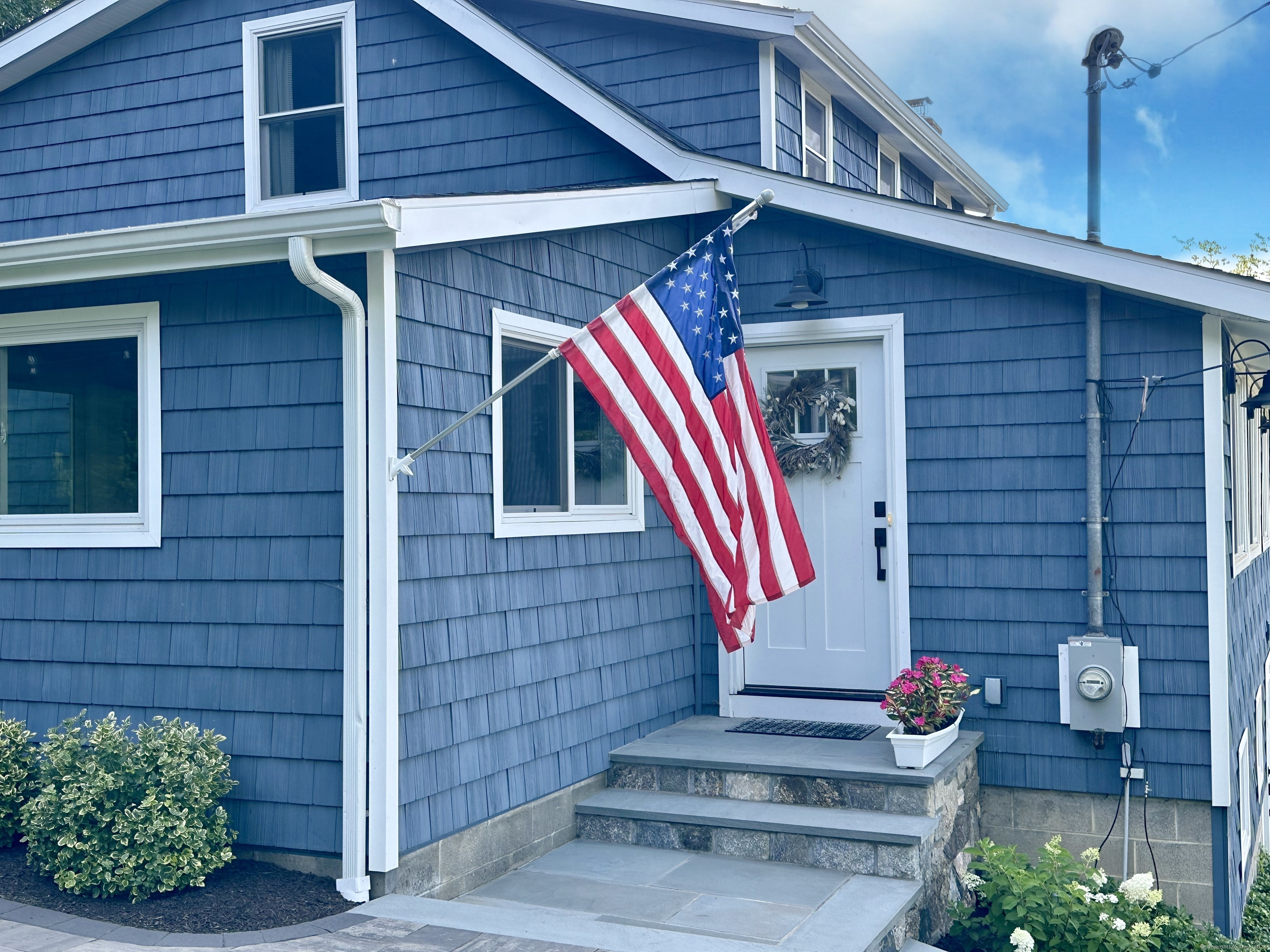 41 Candlewood Drive New Fairfield, CT 06812 - Photo 16 of 16 a front view of a house with fountain
