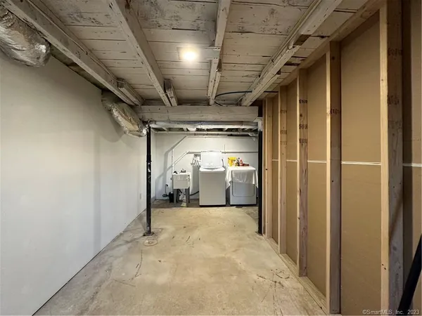 a view of a hallway with wooden walls
