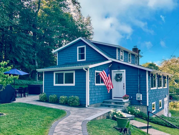 a front view of a house with garden