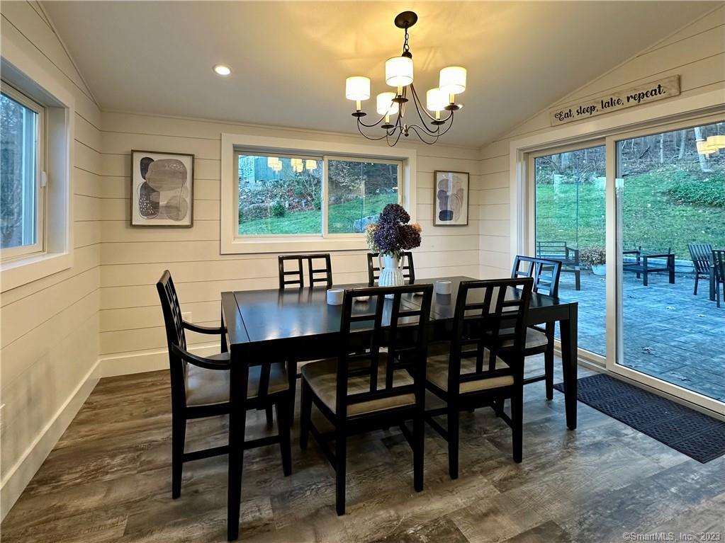 41 Candlewood Drive New Fairfield, CT 06812 - Photo 6 of 16 a view of a dining room with furniture a chandelier and wooden floor
