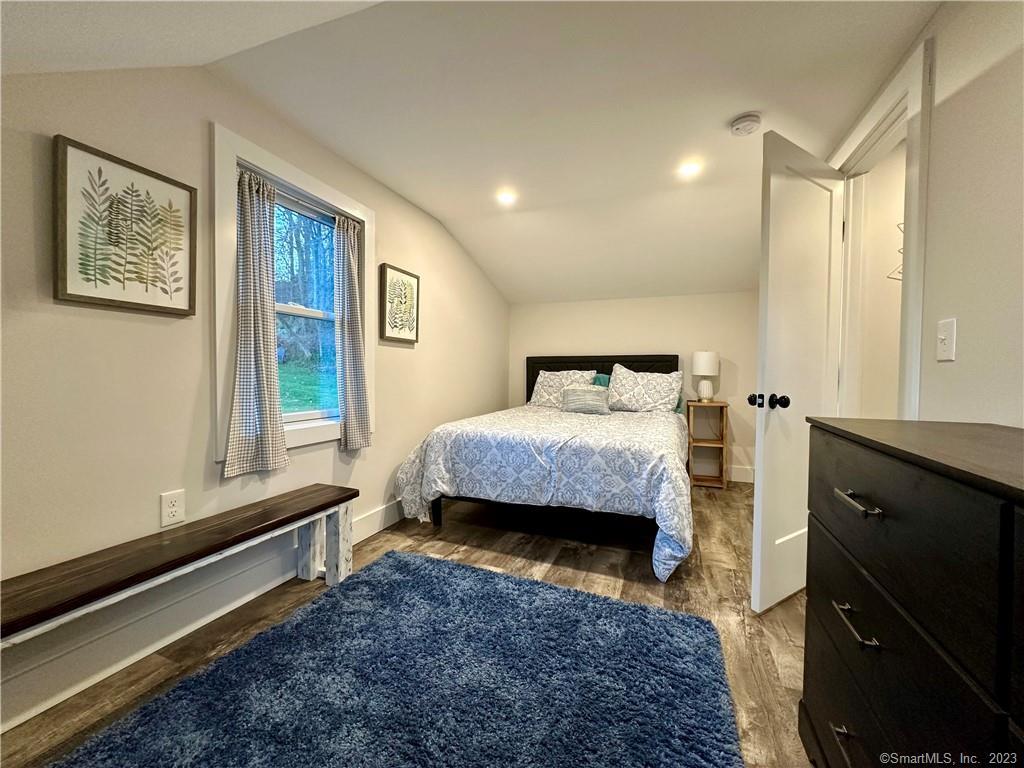 41 Candlewood Drive New Fairfield, CT 06812 - Photo 9 of 16 a bedroom with a bed and a window