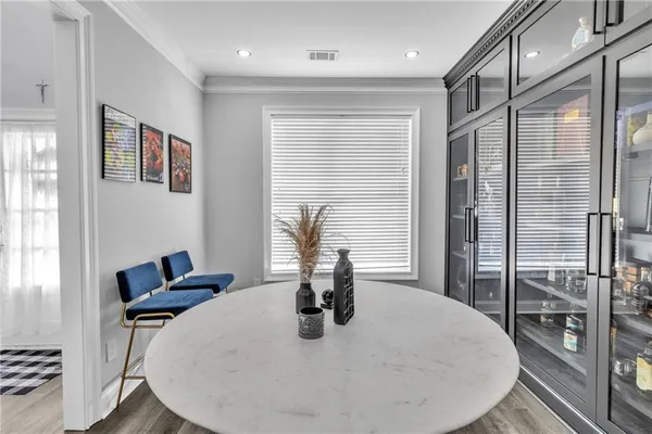 a dining room with furniture and window