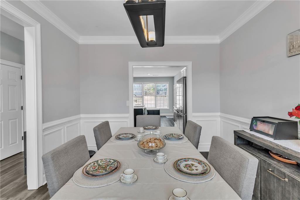 2800 Barimore Place Dacula, GA 30019 - Photo 13 of 51 a view of a dining room that has a table and chairs in it