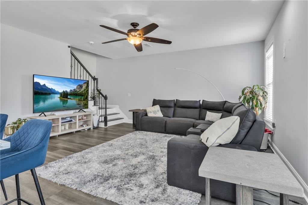 2800 Barimore Place Dacula, GA 30019 - Photo 21 of 51 a living room with furniture and a flat screen tv