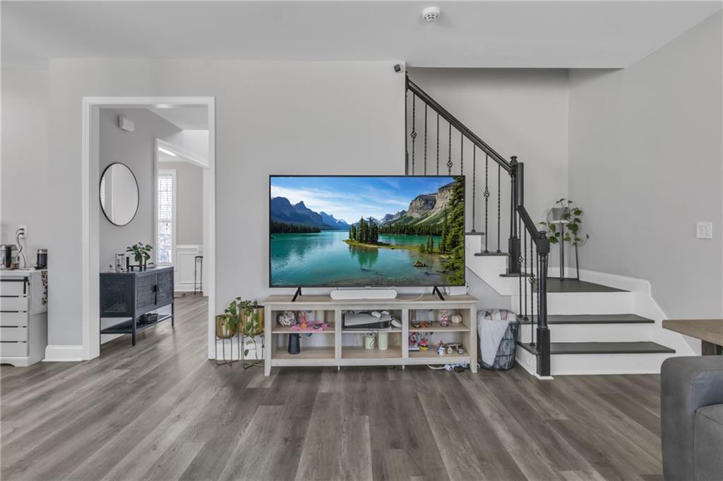 2800 Barimore Place Dacula, GA 30019 - Photo 22 of 51 a living room with furniture and a flat screen tv