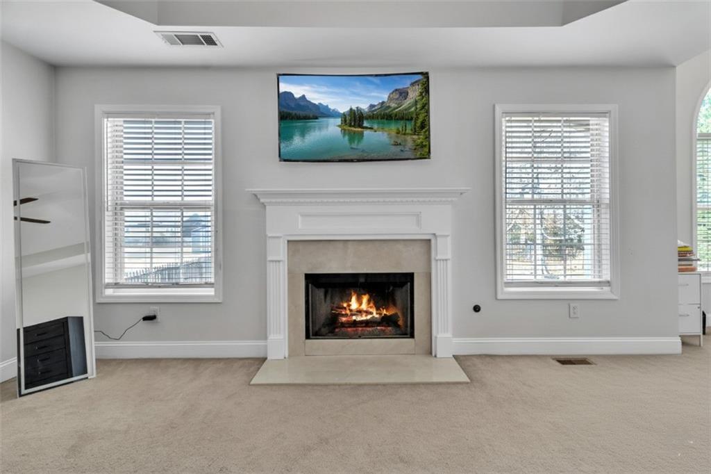 2800 Barimore Place Dacula, GA 30019 - Photo 29 of 51 a living room with furniture and a fireplace