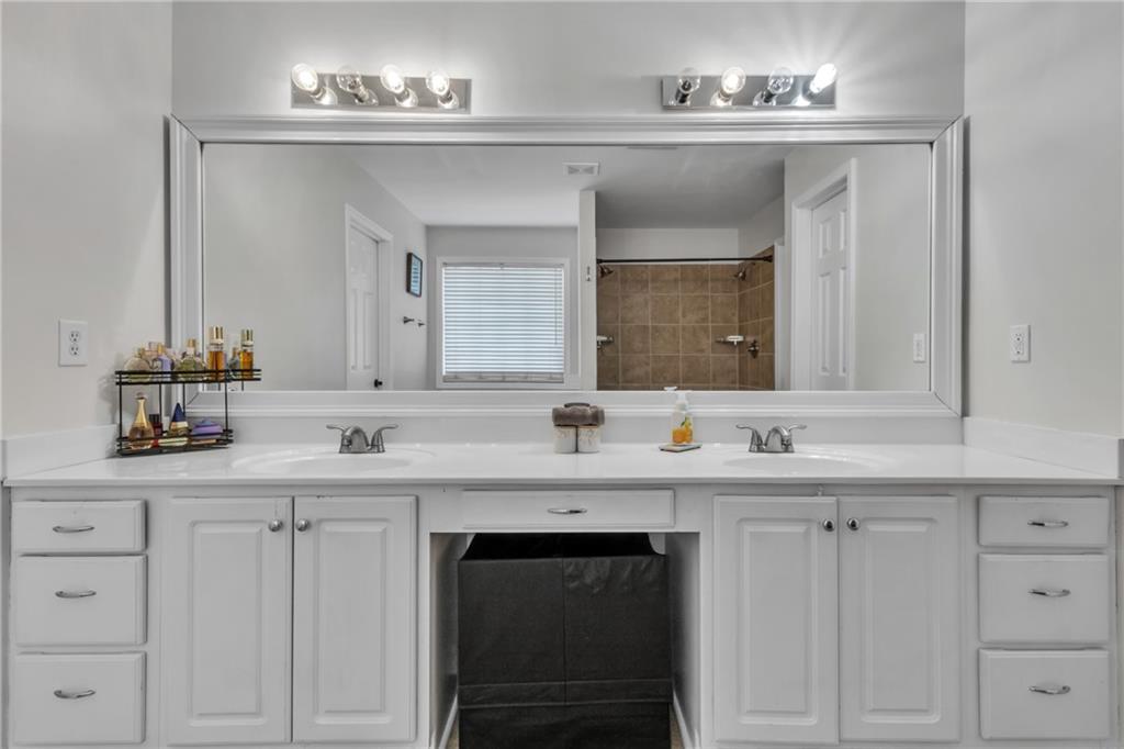 2800 Barimore Place Dacula, GA 30019 - Photo 32 of 51 a view of two sink a mirror and a lamp