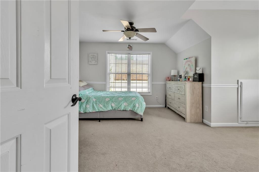 2800 Barimore Place Dacula, GA 30019 - Photo 40 of 51 a bedroom with bed and window
