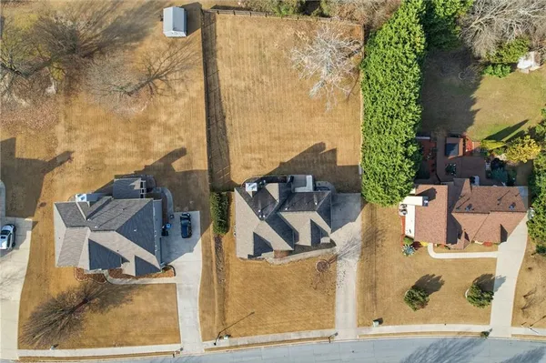 an aerial view of residential houses with outdoor space