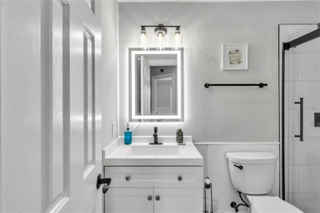 2800 Barimore Place Dacula, GA 30019 - Photo 42 of 51 a bathroom with a sink a toilet and shower