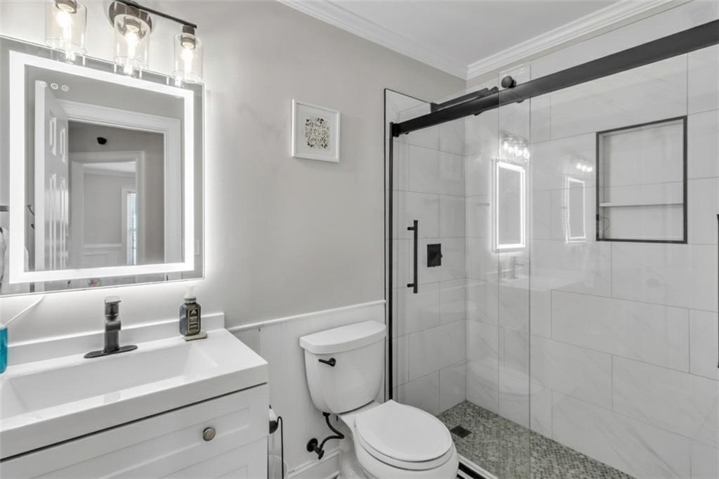 2800 Barimore Place Dacula, GA 30019 - Photo 43 of 51 a bathroom with a sink vanity mirror and toilet