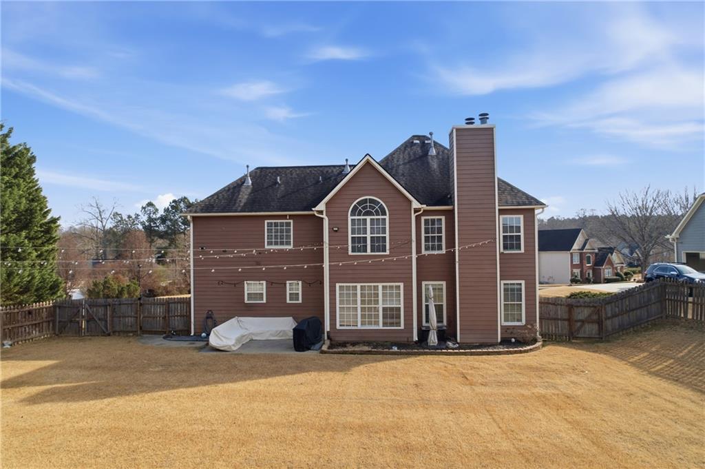 2800 Barimore Place Dacula, GA 30019 - Photo 48 of 51 a view of a big house with a street