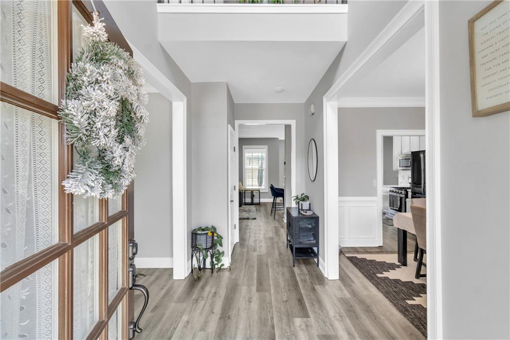2800 Barimore Place Dacula, GA 30019 - Photo 9 of 51 a view of a hallway with wooden floor and furniture