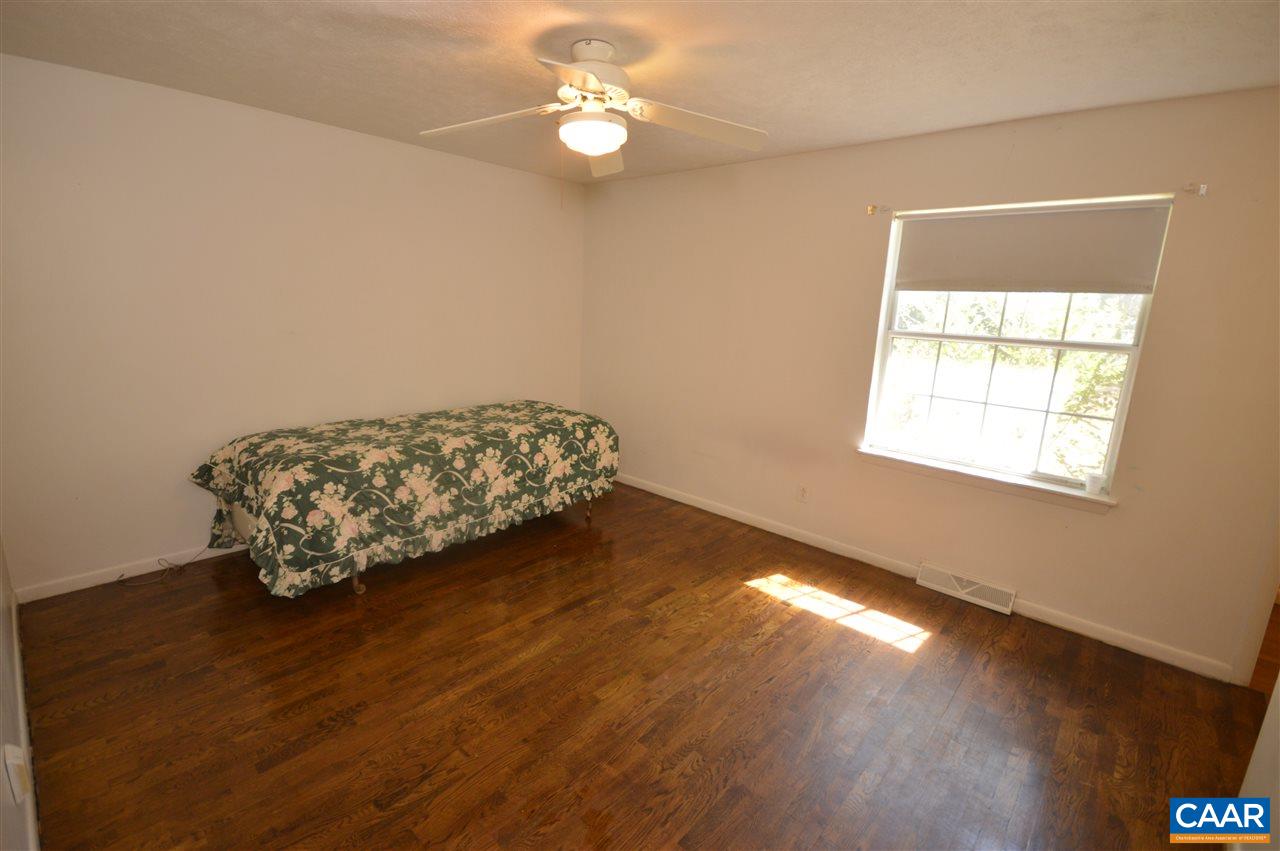 88 Pinewood Court Ruckersville, VA 22968 - Photo 12 of 22 a room with wooden floor and a window