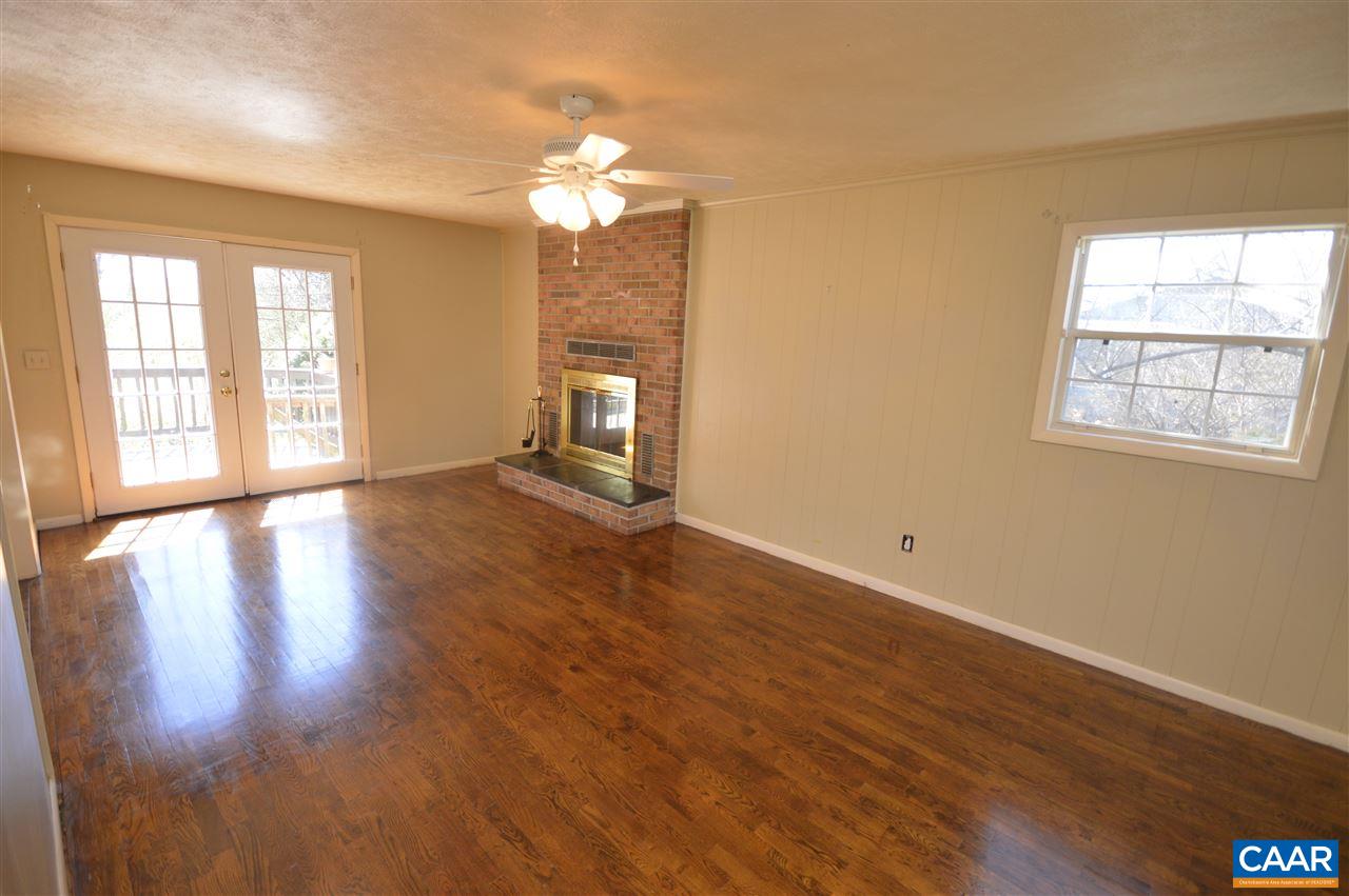 88 Pinewood Court Ruckersville, VA 22968 - Photo 9 of 22 a view of an empty room with wooden floor and a window