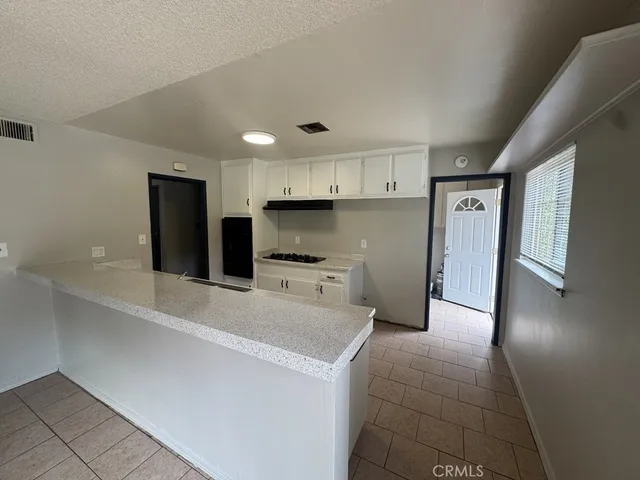 a kitchen with stainless steel appliances a refrigerator and a sink