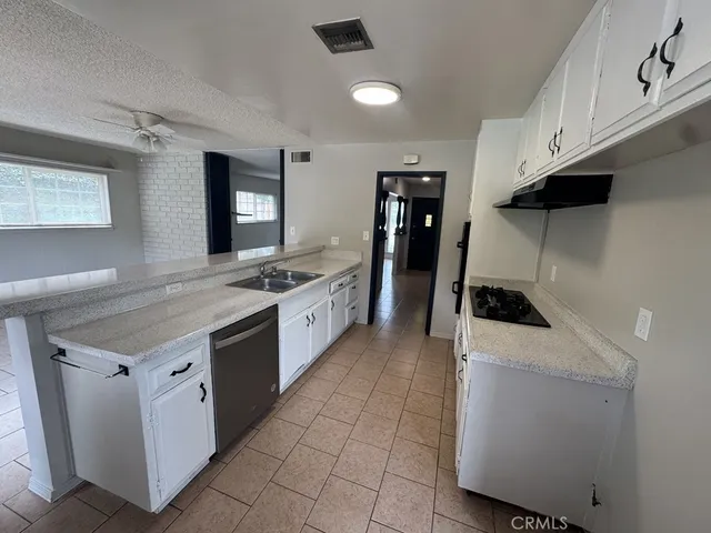 a kitchen with a stove and a sink