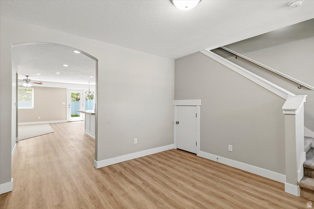 847 225 South Springville, UT 84663 - Photo 2 of 23 Light wood-finish flooring extending through an arched entryway. New flooring throughout entry and front room