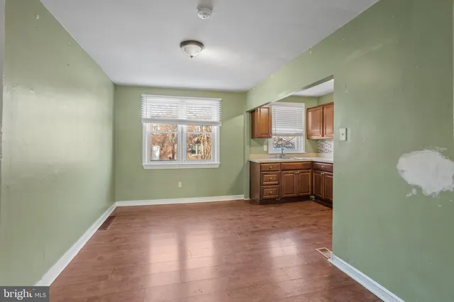 a kitchen with a sink and a stove top oven