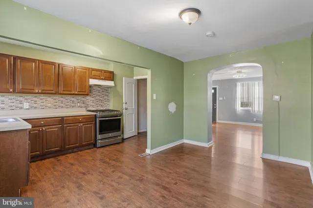 a view of a kitchen cabinets and wooden floor