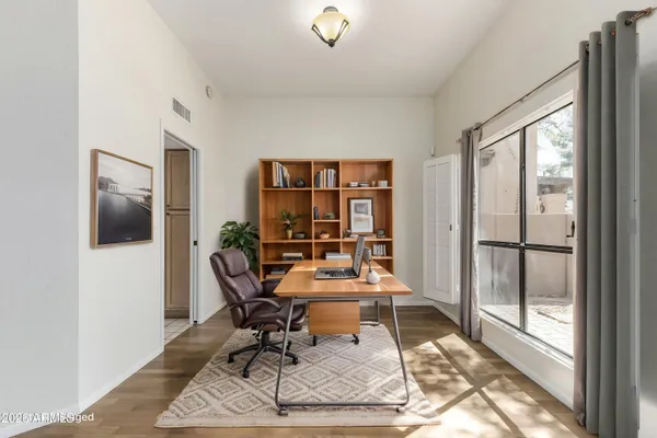 a view of empty room with ceiling fan