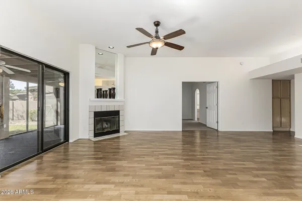 a kitchen with granite countertop a stove sink and microwave