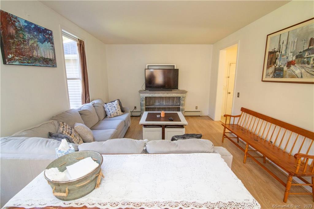 82 Fowler Road North Stonington, CT 06359 - Photo 21 of 36 a living room with furniture and a window