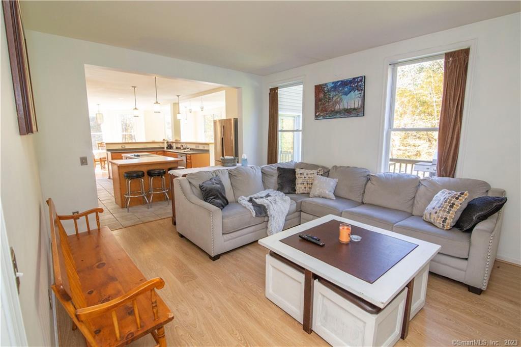 82 Fowler Road North Stonington, CT 06359 - Photo 22 of 36 a living room with furniture and a large window