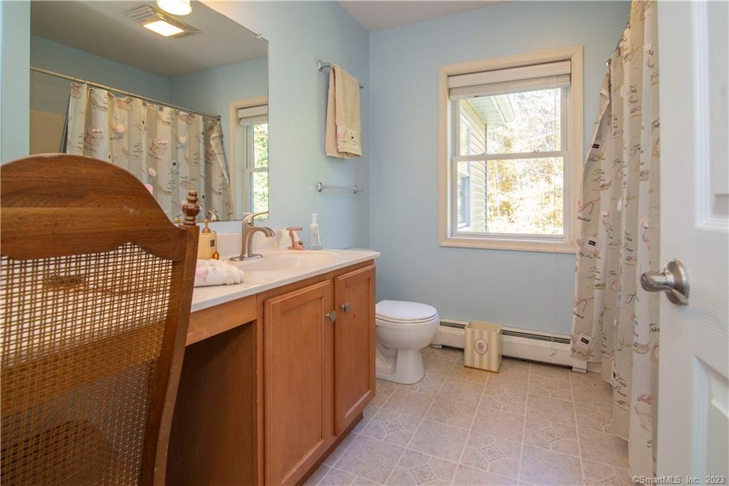 82 Fowler Road North Stonington, CT 06359 - Photo 24 of 36 a bathroom with a sink toilet and window