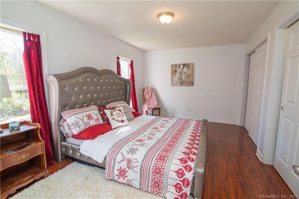 82 Fowler Road North Stonington, CT 06359 - Photo 26 of 36 a bedroom with a bed and a window