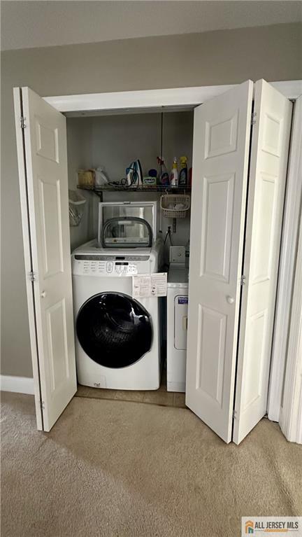 238 Nebula Road, Unit 238 Piscataway, NJ 08854 - Photo 12 of 22 a utility room with dryer and washer