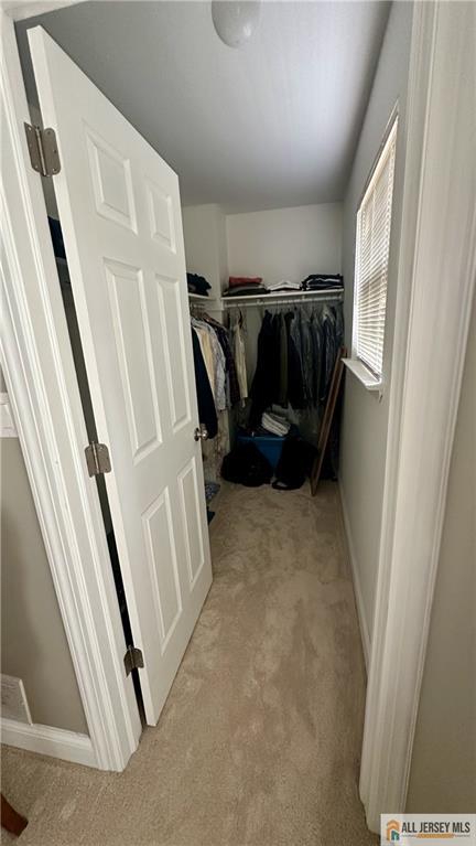 238 Nebula Road, Unit 238 Piscataway, NJ 08854 - Photo 16 of 22 a view of walk in closet with clothes and shoes