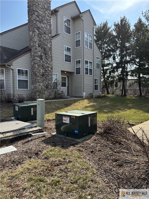 238 Nebula Road, Unit 238 Piscataway, NJ 08854 - Photo 22 of 22 a view of a yard with chairs
