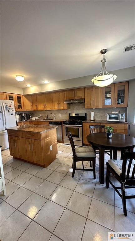 238 Nebula Road, Unit 238 Piscataway, NJ 08854 - Photo 6 of 22 a kitchen with a sink a counter top space appliances and cabinets