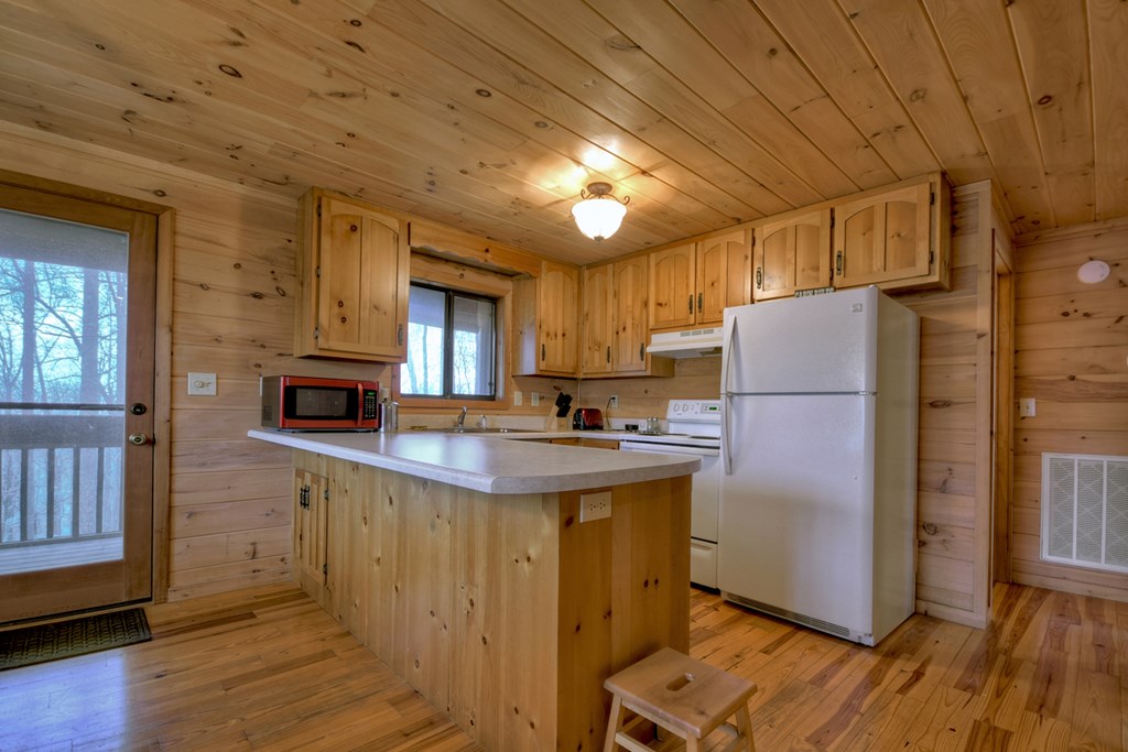 1285 Walnut Ridge Ellijay, GA 30536 - Photo 12 of 38 a kitchen with refrigerator and cabinets