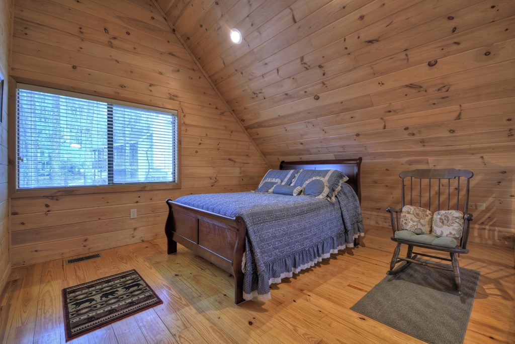 1285 Walnut Ridge Ellijay, GA 30536 - Photo 24 of 38 a bedroom with a bed and a window