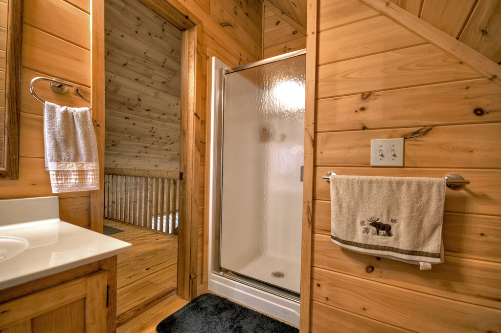 1285 Walnut Ridge Ellijay, GA 30536 - Photo 26 of 38 a bathroom with a sink and mirror