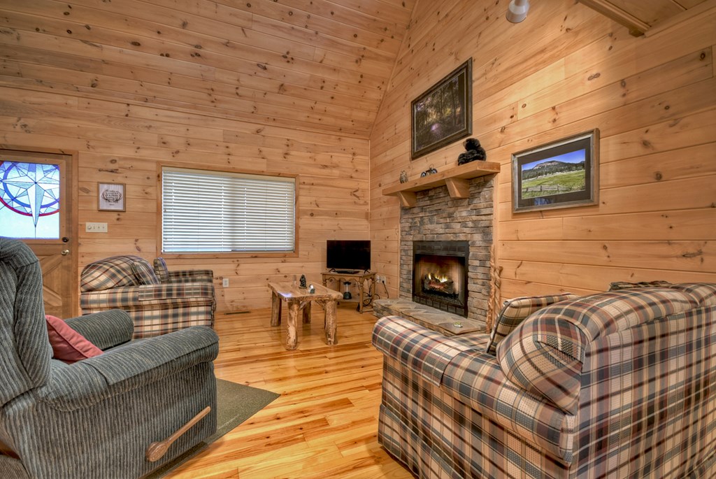 1285 Walnut Ridge Ellijay, GA 30536 - Photo 8 of 38 a living room with furniture and a fireplace