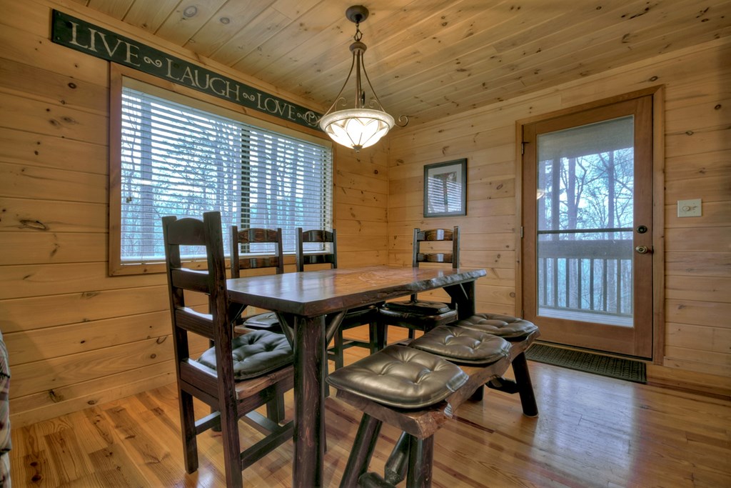 1285 Walnut Ridge Ellijay, GA 30536 - Photo 9 of 38 a view of a dining room with furniture and a chandelier