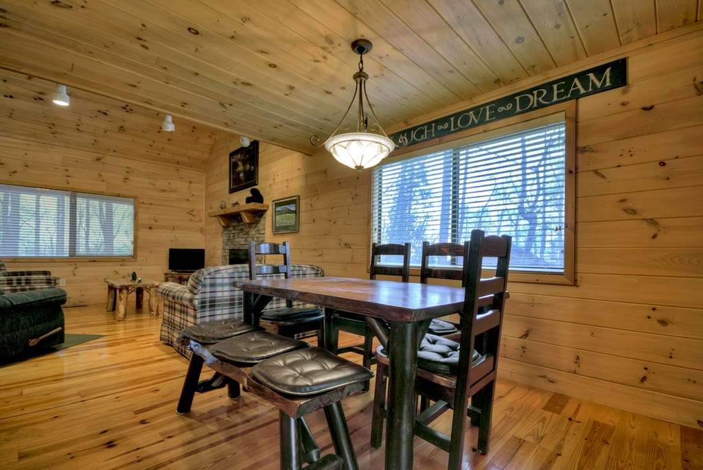 1285 Walnut Ridge Ellijay, GA 30536 - Photo 10 of 38 a view of a dining room with furniture window and wooden floor