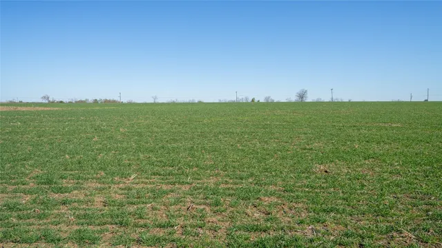 a view of a field with an outdoor space
