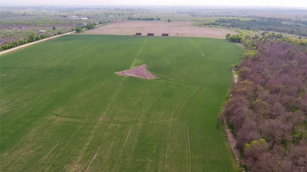 a view of a field with an outdoor space