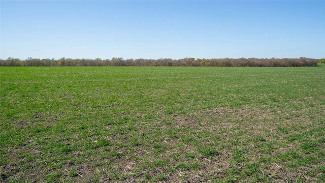 a view of a field with an outdoor space