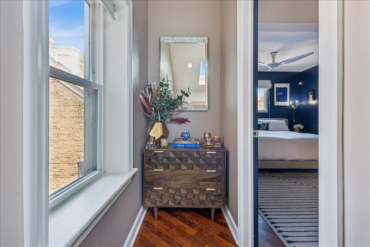 561 West Briar Place, Unit 305 Chicago, IL 60657 - Photo 12 of 23 a view of a hallway and a livingroom with furniture