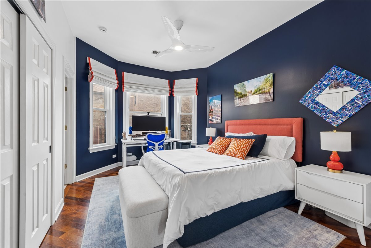 561 West Briar Place, Unit 305 Chicago, IL 60657 - Photo 16 of 23 a bedroom with a bed and a large window with outer view