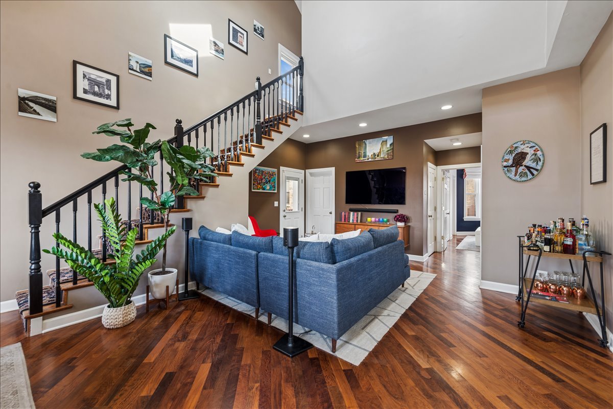 561 West Briar Place, Unit 305 Chicago, IL 60657 - Photo 2 of 23 a living room with furniture and wooden floor