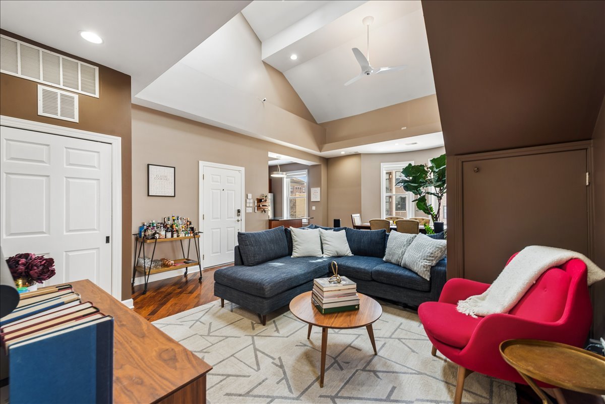 561 West Briar Place, Unit 305 Chicago, IL 60657 - Photo 3 of 23 a living room with furniture and a wooden floor