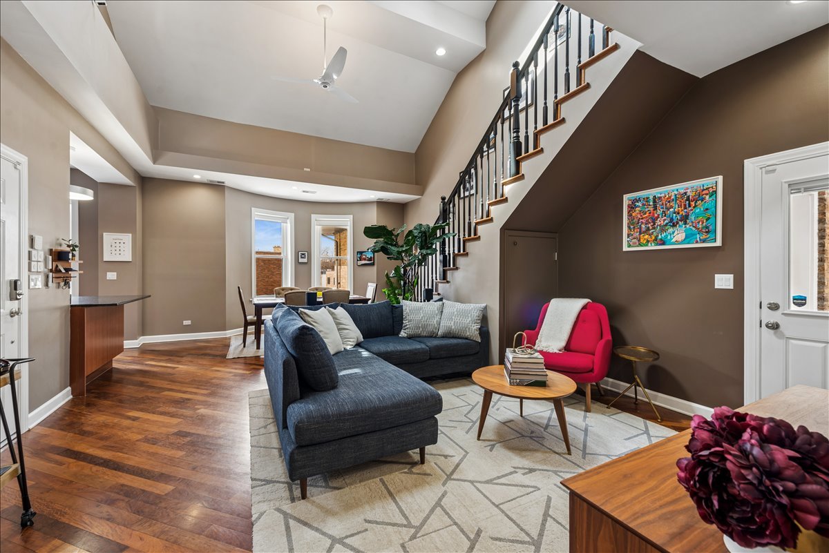 561 West Briar Place, Unit 305 Chicago, IL 60657 - Photo 4 of 23 a living room with furniture and wooden floor