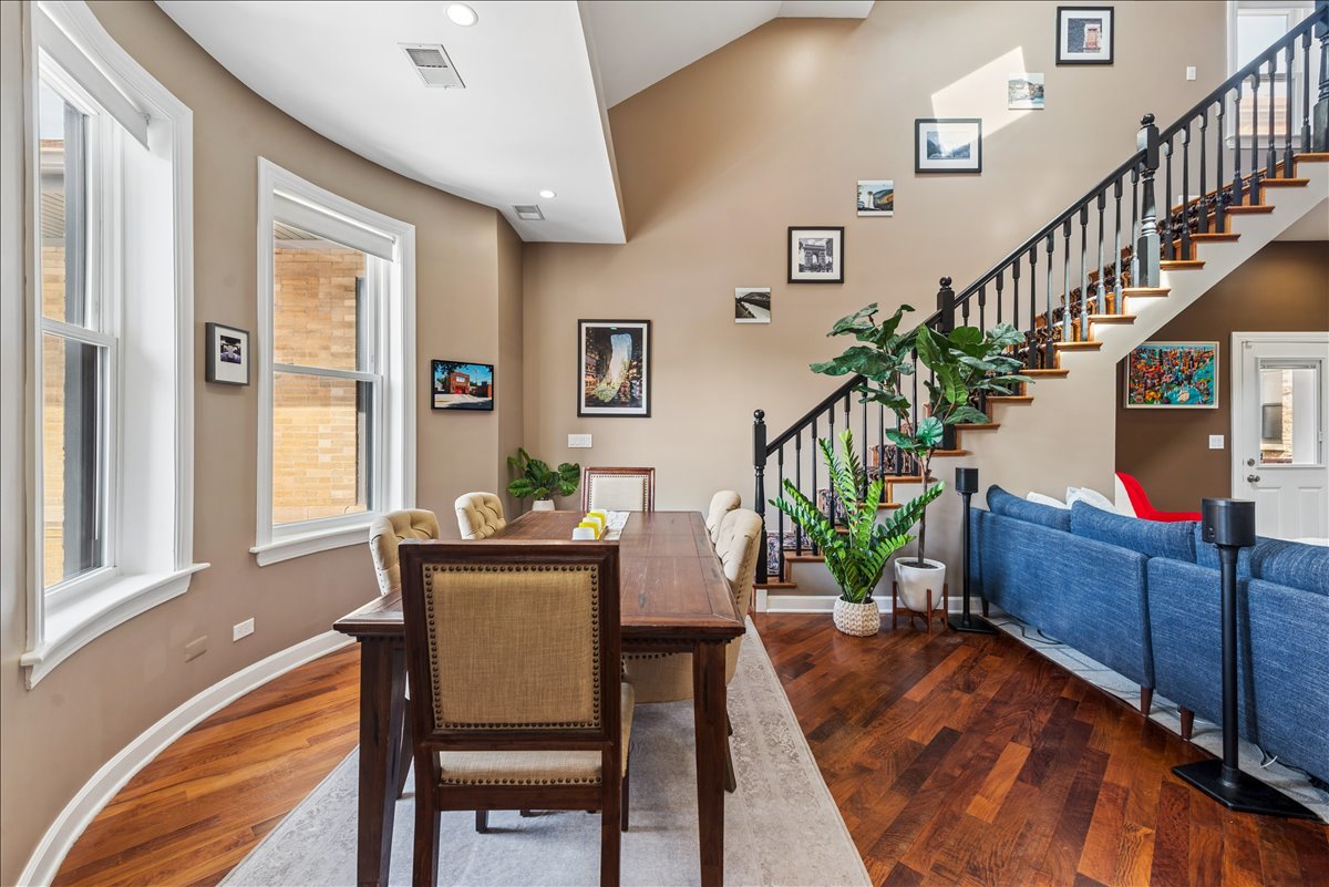 561 West Briar Place, Unit 305 Chicago, IL 60657 - Photo 5 of 23 a view of a dining room with furniture and a potted plant